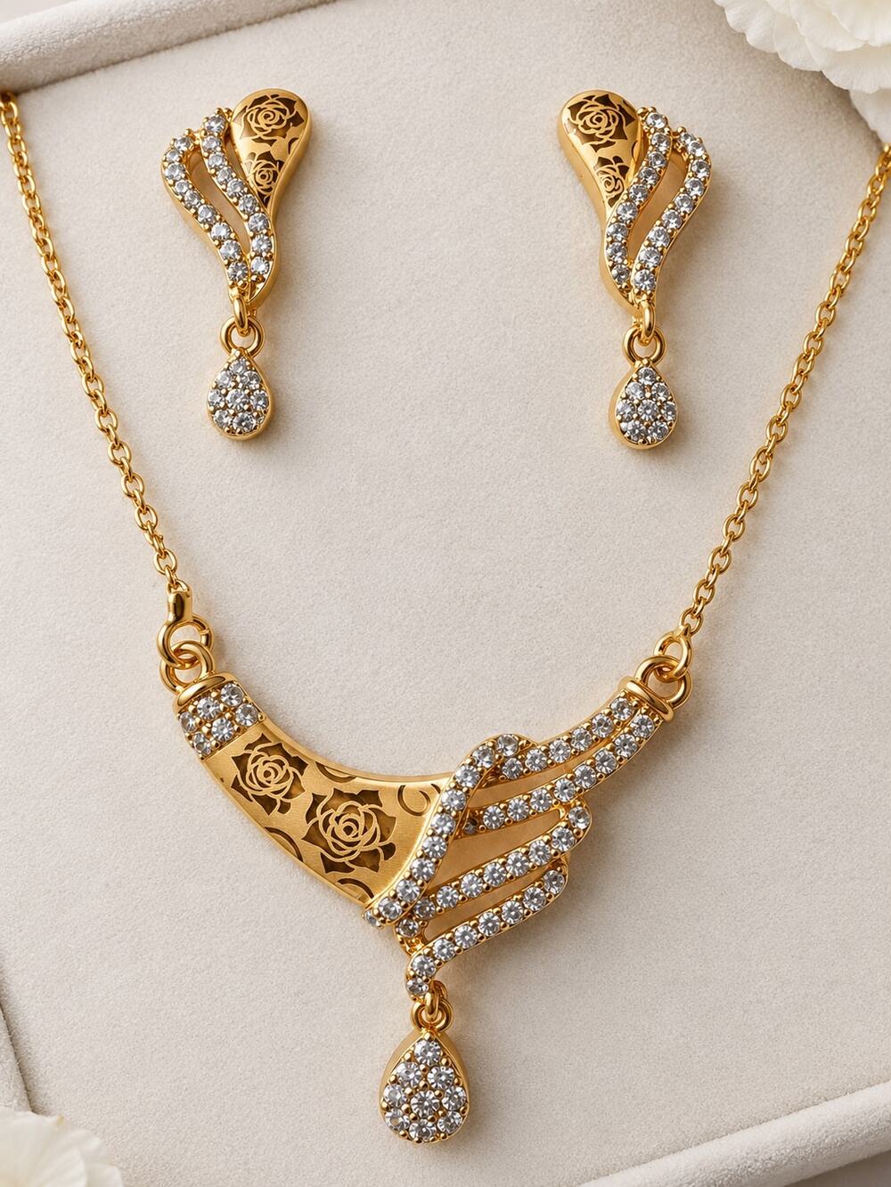 gold plated CZ necklace and earrings set with teardrop crystal dangles and flora
